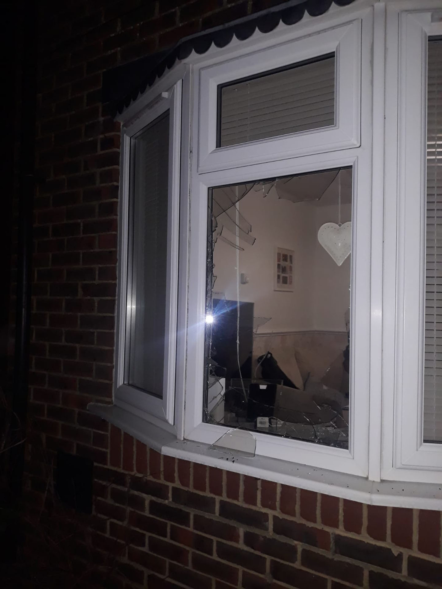 Croydon family home - broken front window.